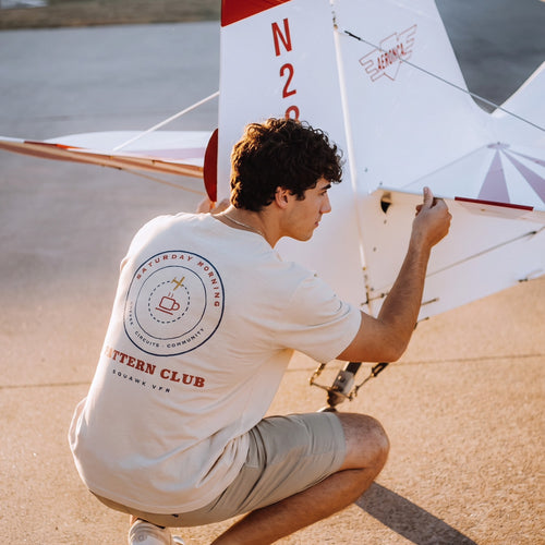 On-model — Saturday Morning Pattern Club Tee back print, worn while working on a taildragger tail, SquawkVFR