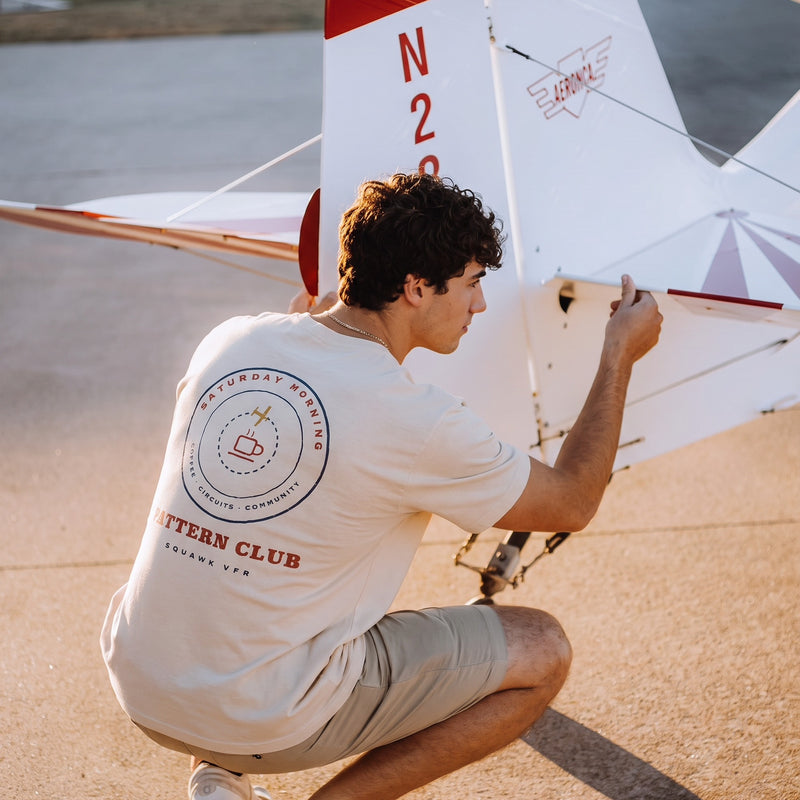 On-model — Saturday Morning Pattern Club Tee back print, worn while working on a taildragger tail, SquawkVFR