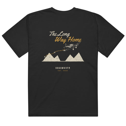The Long Way Home aviation tee — back print of a single crossing the mountains on a dashed course line, black garment-dyed cotton
